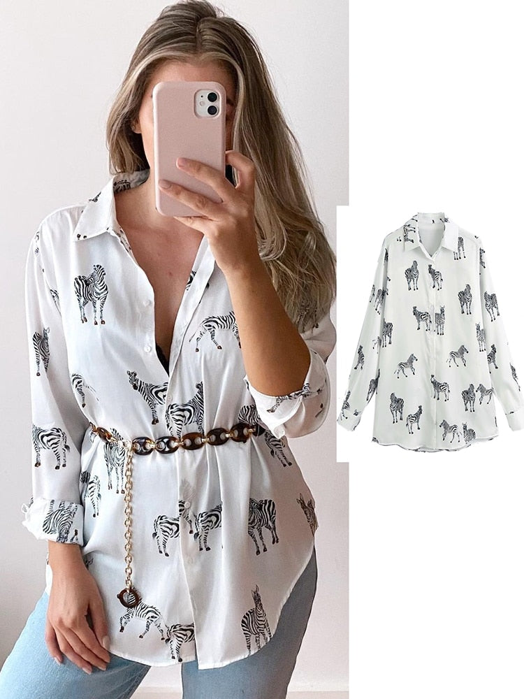 Blusa satinada cebra de manga larga